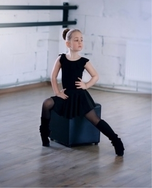 girl sitting on stool posing